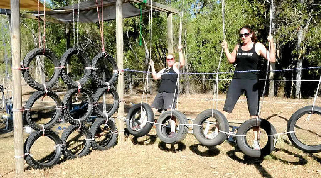 Two TexFit team members, Alena Shannon and Lynda Gillman, master the tyre wall. Two TexFit team members, Alena Shannon and Lynda Gillman, master the tyre wall.